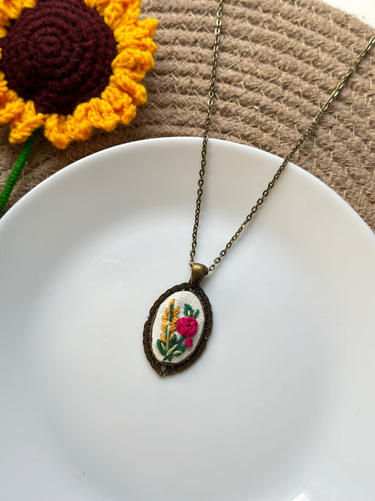 Hand-embroidered floral pendant