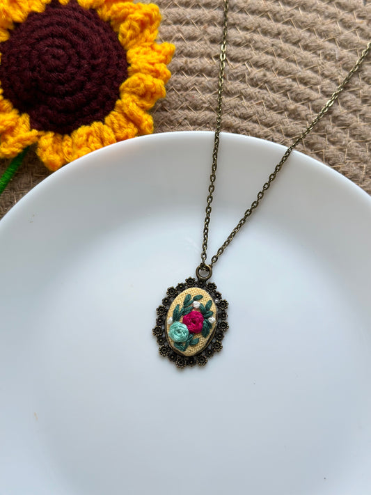 Hand-embroidered floral pendant