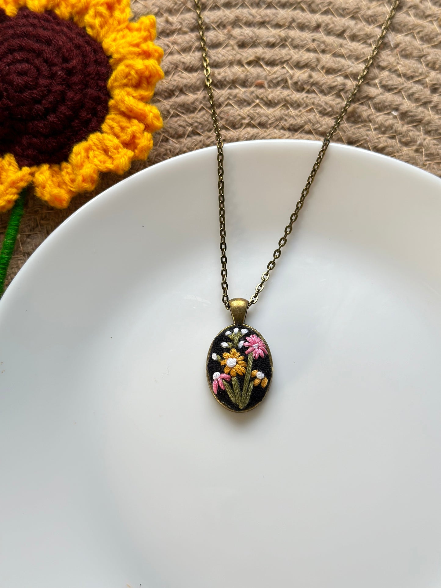 Hand-embroidered floral pendant