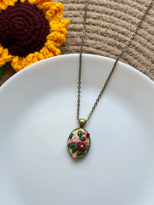 Hand-embroidered rose pendant