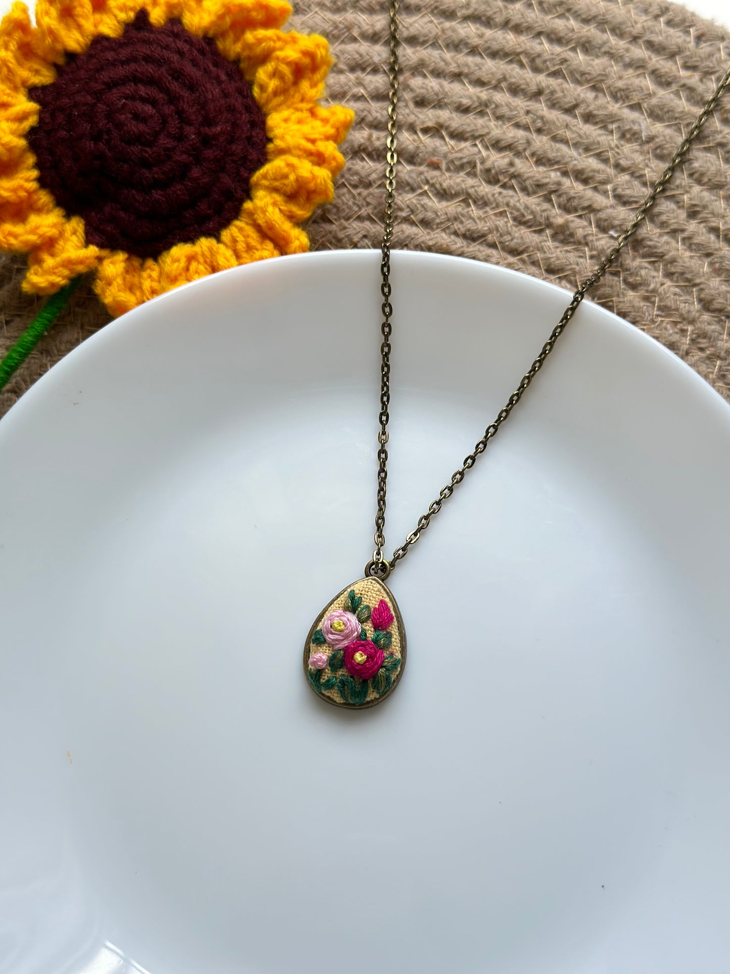 Hand-embroidered floral pendant