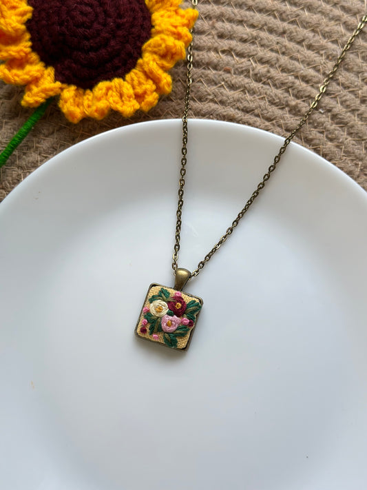 Hand-embroidered floral pendant