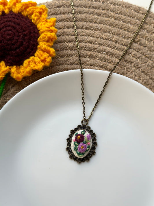 Hand-embroidered floral pendant