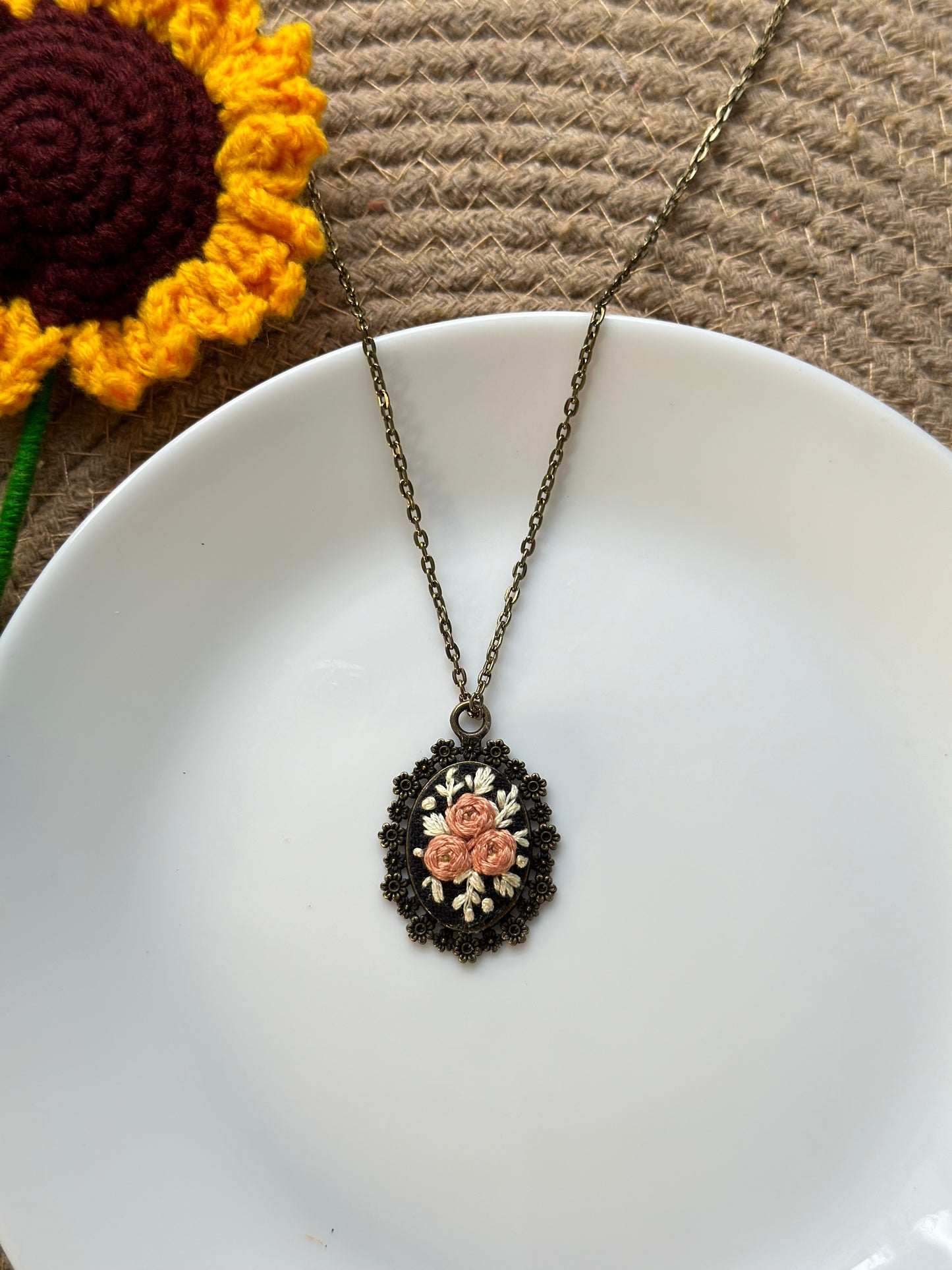 Hand-embroidered rose pendant