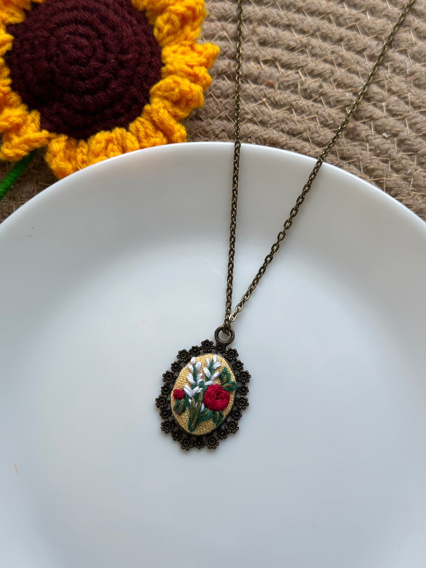 Hand-embroidered floral pendant