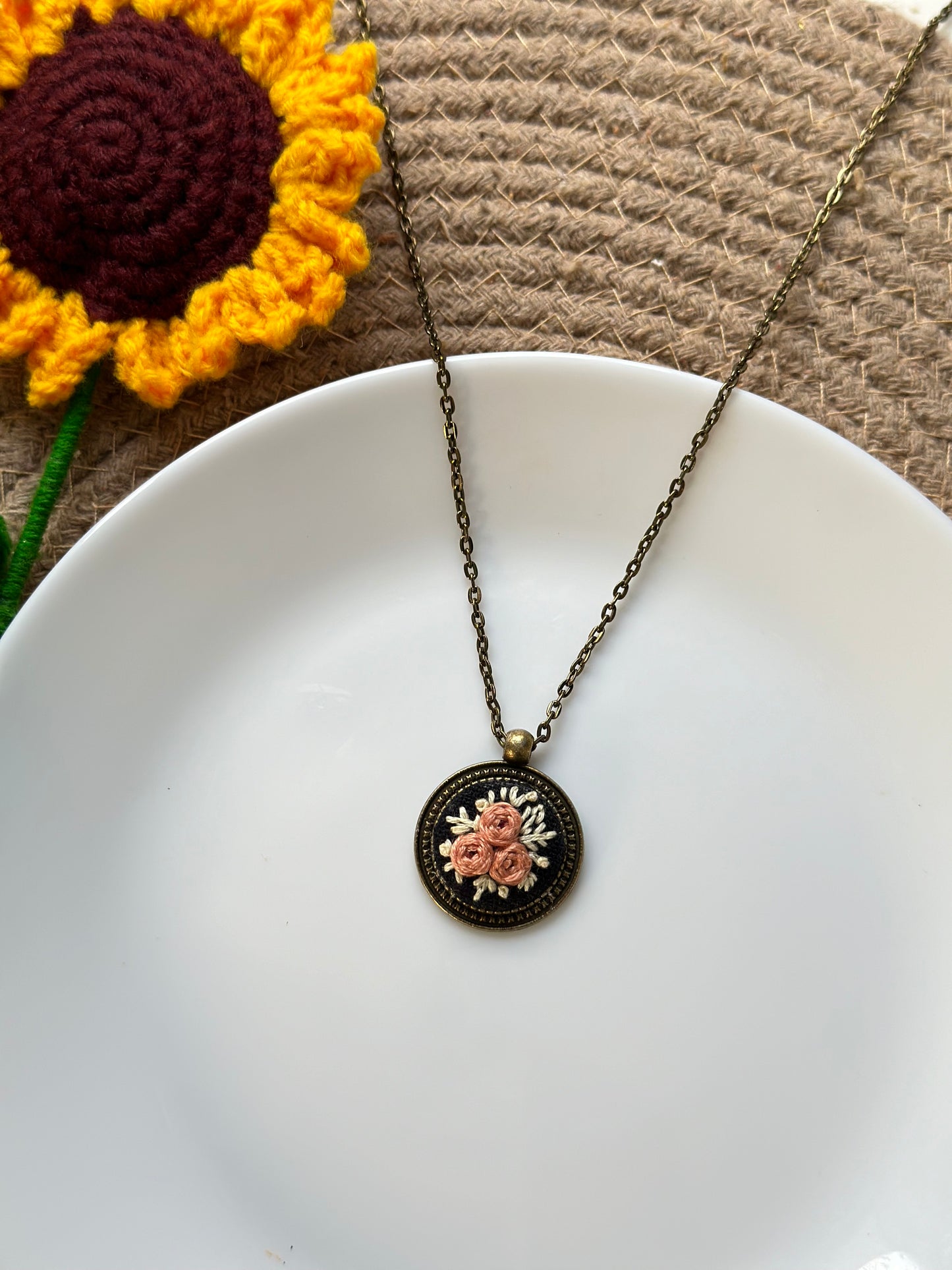 Hand-embroidered rose pendant