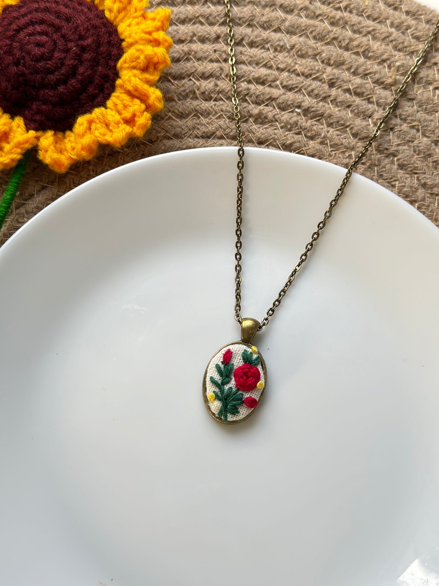 Hand-embroidered rose pendant