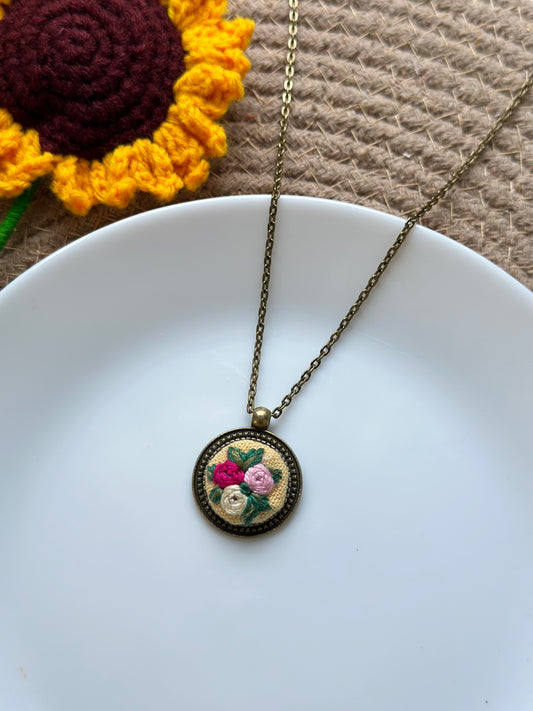 Hand-embroidered rose pendant